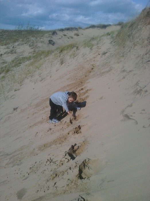 Jonas climbing the dune