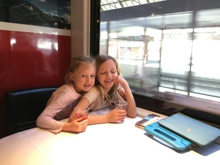Leaving Munich and headed to Geneva. We explored the Dining car. Its fun and you can eat but it is expensive for what you get. Theres our ipads. haha. They keep children happy on trains.