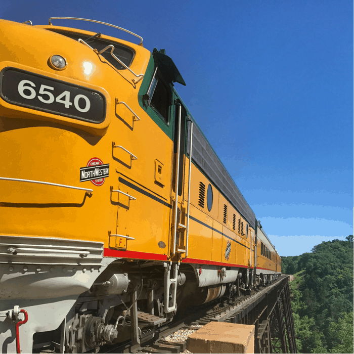 yellow train on the train bridge for Boone and Scenic Valley Railroad in Iowa
