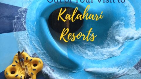 Overhead view of a yellow raft with people on a blue water slide at Kalahari Resorts.