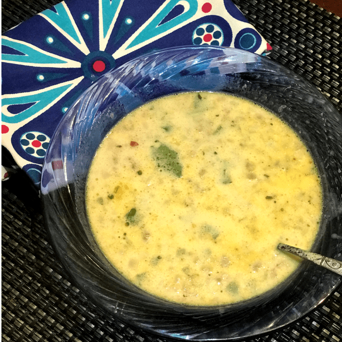 Potato and Kale Soup with Zesty Sausage in soup bowl