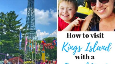 Smiling woman and child at Kings Island amusement park, with its iconic Eiffel Tower replica and guests walking.