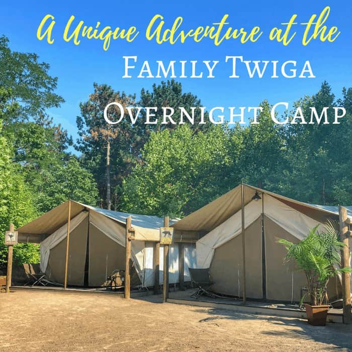 Overnight safari tents at Zoo Safari Park Stukenbrocks Family Twiga Camp on a sunny day.