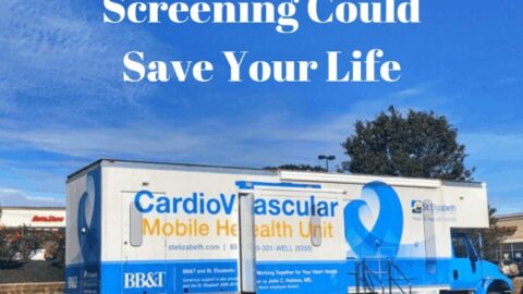 Cardiovascular mobile health unit parked in a lot under a blue sky.