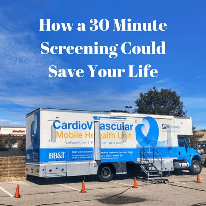 Cardiovascular mobile health unit parked in a lot under a blue sky.