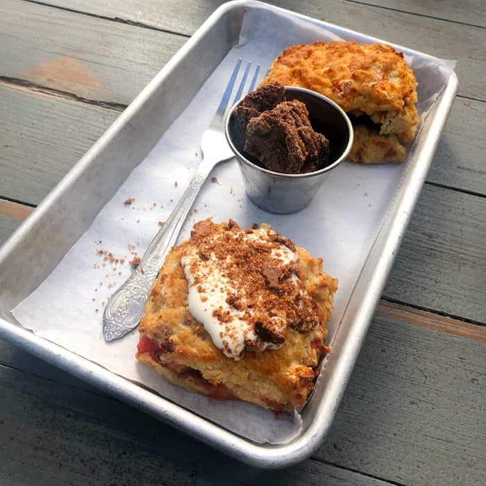 Savory Biscuit (Cumin, roasted tomato with rainbow chard fluff) and the Sweet Biscuit (strawberry with sweet fluff and pecan crumbles) and Side of Candied Pecans at The Greenhouse on Porter in Ocean Springs, MS