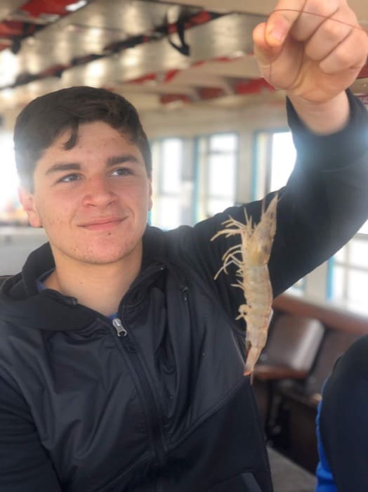 holding sealife on Biloxi Shrimping Trip