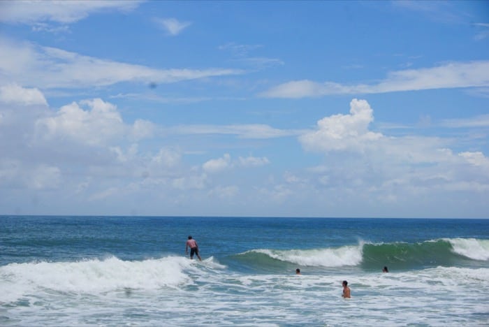 surfers near Cape Hatteras Lighthouse beach
