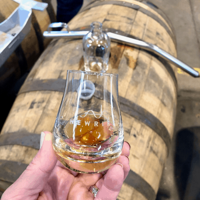 tasting from a barrel at New Riff West Newport Warehouse Campus