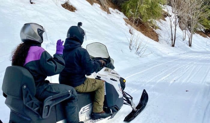 couple on Guided Tour with Leavenworth Snowmobile Tours