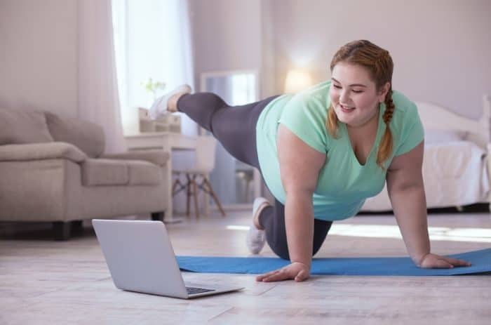 woman taking online fitness class