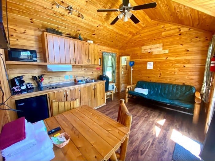 kitchen and family room the Deluxe Cabin at Port Huron KOA Resort 