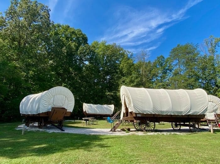 sleep in Covered wagons at Sheltowee Trace Adventure Resort in Kentucky