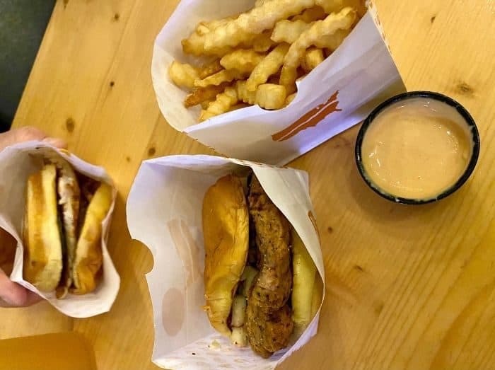 chicken sandwiches and fries at Fifty West Brewing Burger Bar