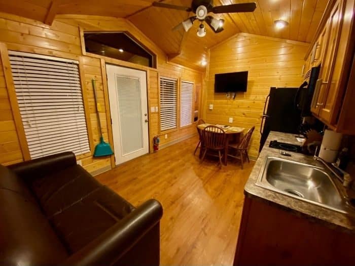 kitchen and family room in the deluxe cabin at night at Cannonville Bryce Canyon KOA