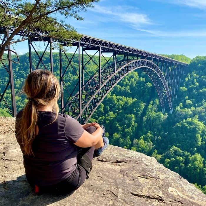 Adventure mom looking at the New River Gorge Bridge