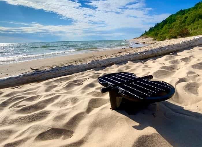 Barbecue on the beach with a portable grill