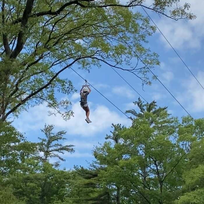 girl ziplining at Muskegon Luge Adventure Sports Park