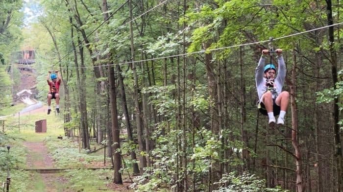 teenagers on dual ziplines at Muskegon Luge Adventure Sports Park