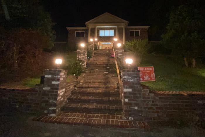Go Lodge Mansion at night