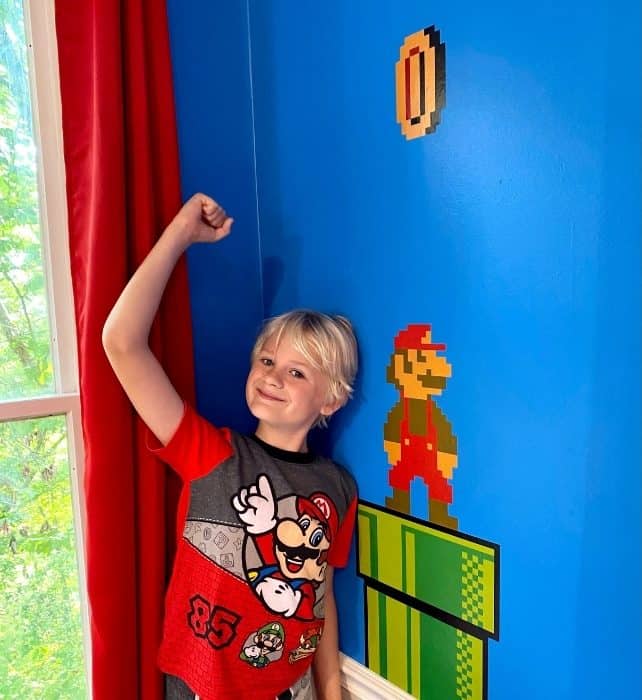 boy in Power Up Kitchen at the Go Lodge game themed mansion