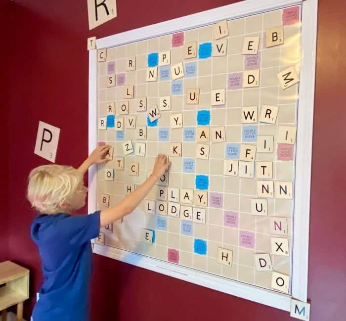 boy playing the Word Play Room at the Go Lodge game themed
