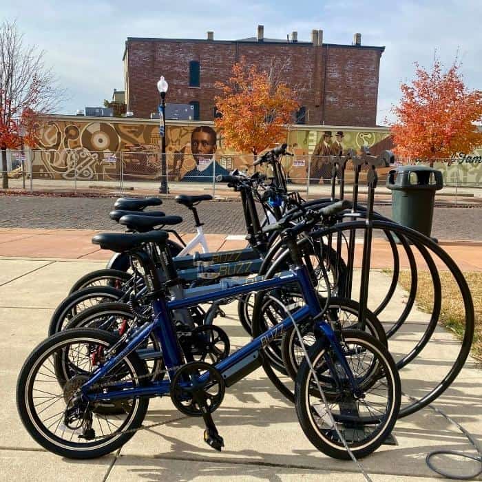 Buzz electric bikes on bike rack in front of Dayton Aviation Heritage National Historical Park 