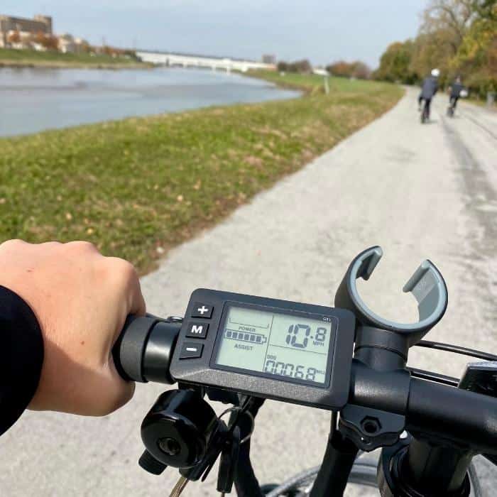 bike riding by the river on a Buzz electric bicycle