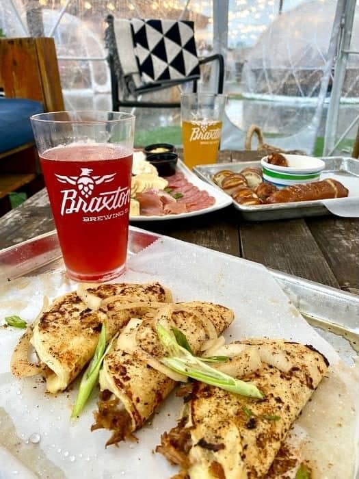 food and drinks inside igloo at Braxton Brewing Company