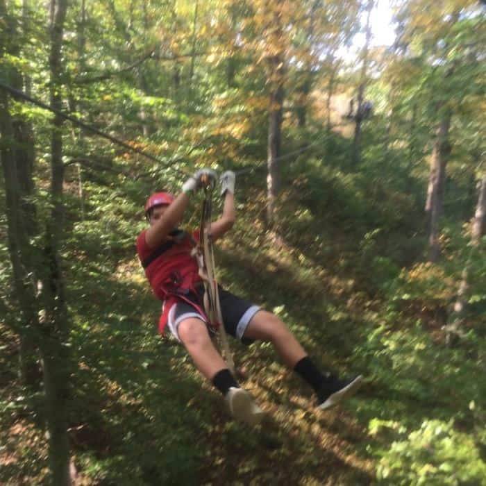 boy ziplining with Hocking Hills Canopy Tours