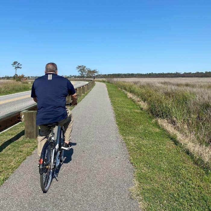 man using bike from Gulf State Park Bike Share Program 