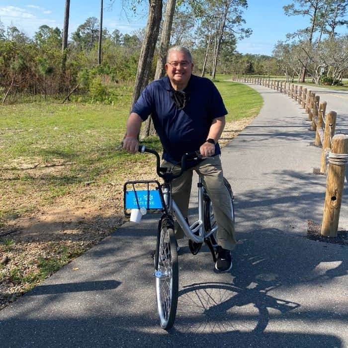 man using bike from Gulf State Park Bike Share Program