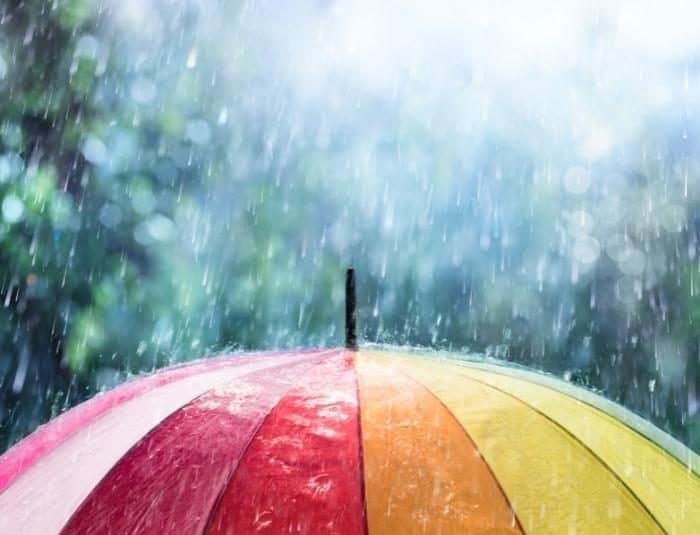 rain falling on colorful umbrella