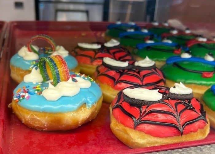 rainbow and spiderman donut at Bismarck Donuts and Coffee