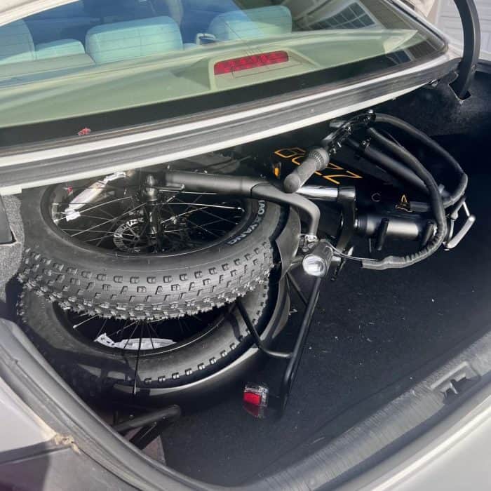 Centris folding electric bike in trunk of a car 