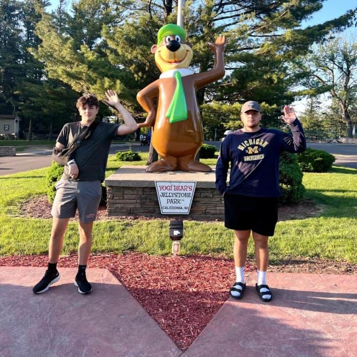 teenagers with Yogi Bear statue at Jellystone Park Camp Resort Caledonia Wisconsin
