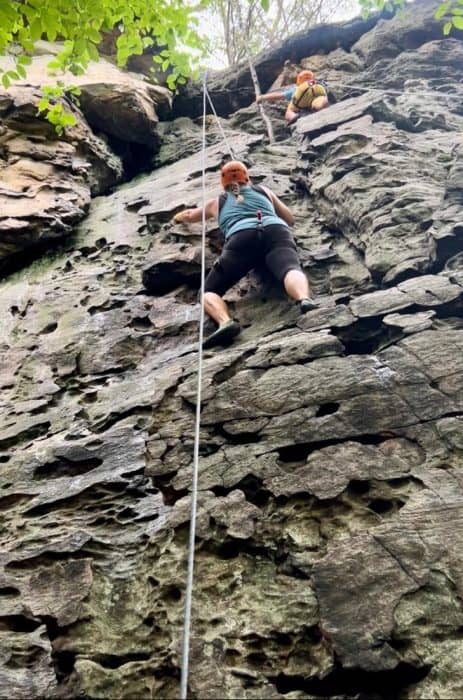 Nedra McDaniel rock climbing in West Virginia