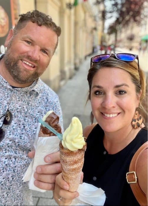 couple with chimney cake with ice cream in Budapest