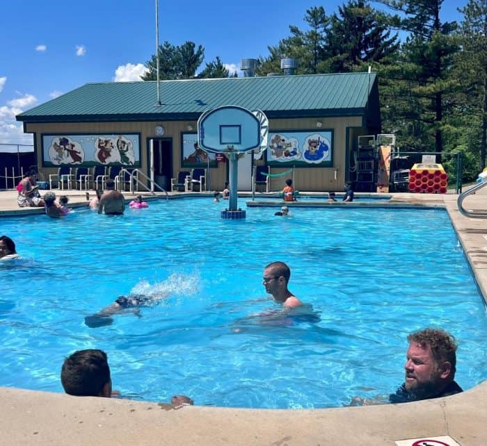 family swimming in heated pool at Yogi Bear's Water Zone