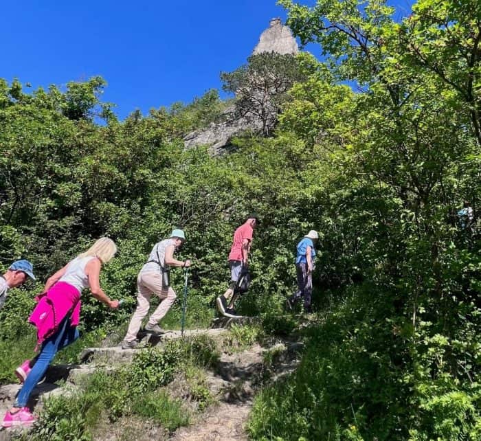 people hiking stairs to the Durstien castle ruins 