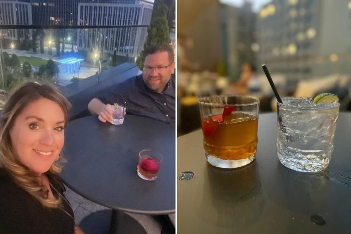 couple with drinks at the  Cannonball Lounge rooftop bar 