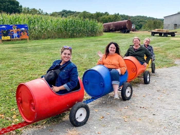 friends in wagon at Ballentine Corn Maze 