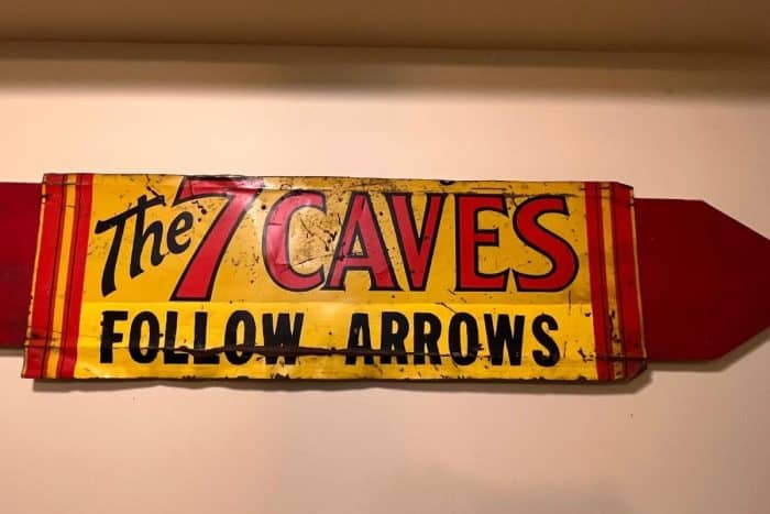 vintage the 7 Caves sign