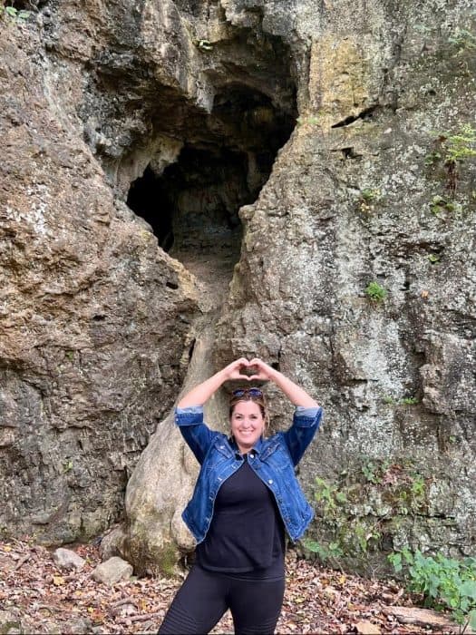 woman near heart shaped rock at Paint Creek State Park
