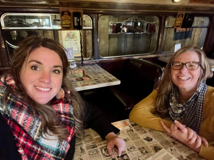 friends inside double decker bus at Clara's Pizza King