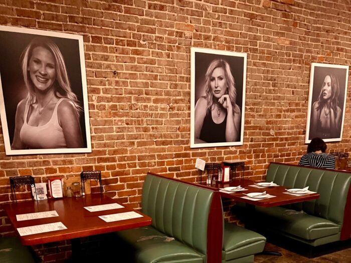 portraits on the wall at Deluca’s Pizzeria 