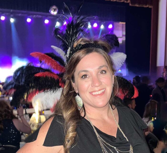 woman wearing headband at Mardi Gras Event
