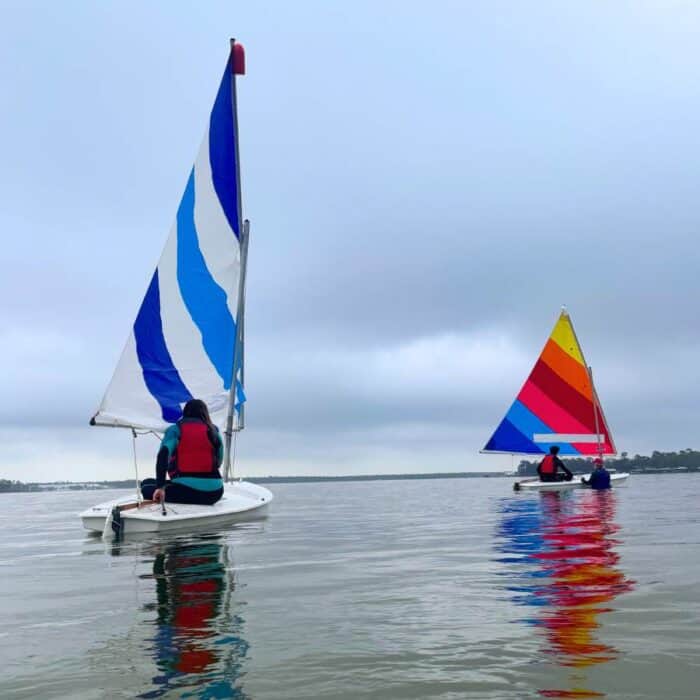 woman and son on Sunfish fleet with Wind and Water Learning Center