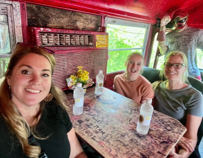 friends inside bus at Hillbilly Hot Dogs