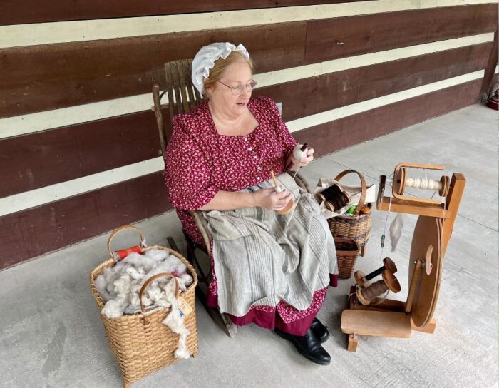 woman spinning wool at Heritage Farm
